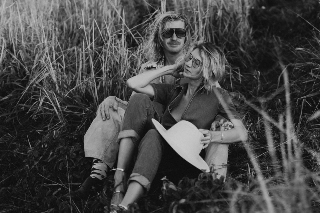 couple cuddling on the ground a on the island of st. croix, USVI