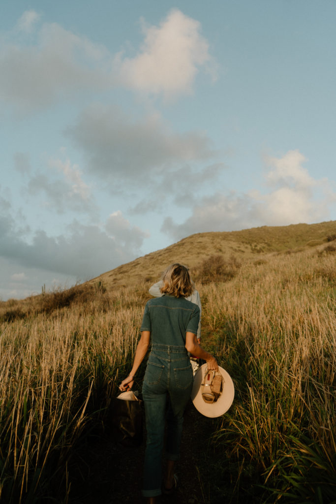 couple walking among the dried grasses on st. croix island