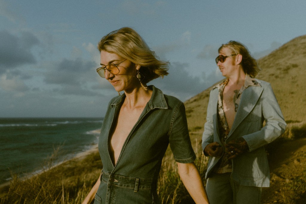 couple walking along the coast at their virgin islands elopement