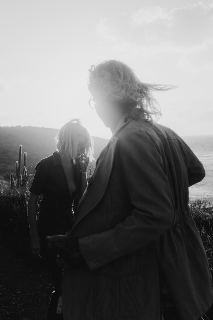 couple walking near the coast at their virgin islands elopement