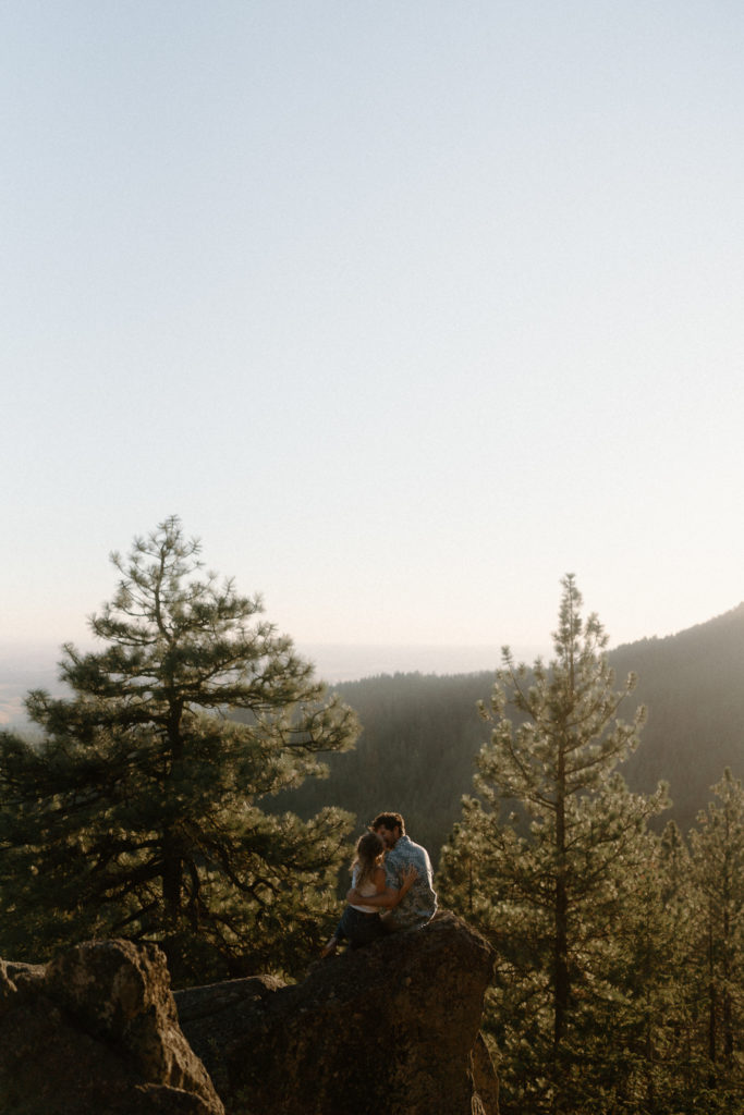 A couple shares and evening engagement session on Moscow Mountain in Idaho