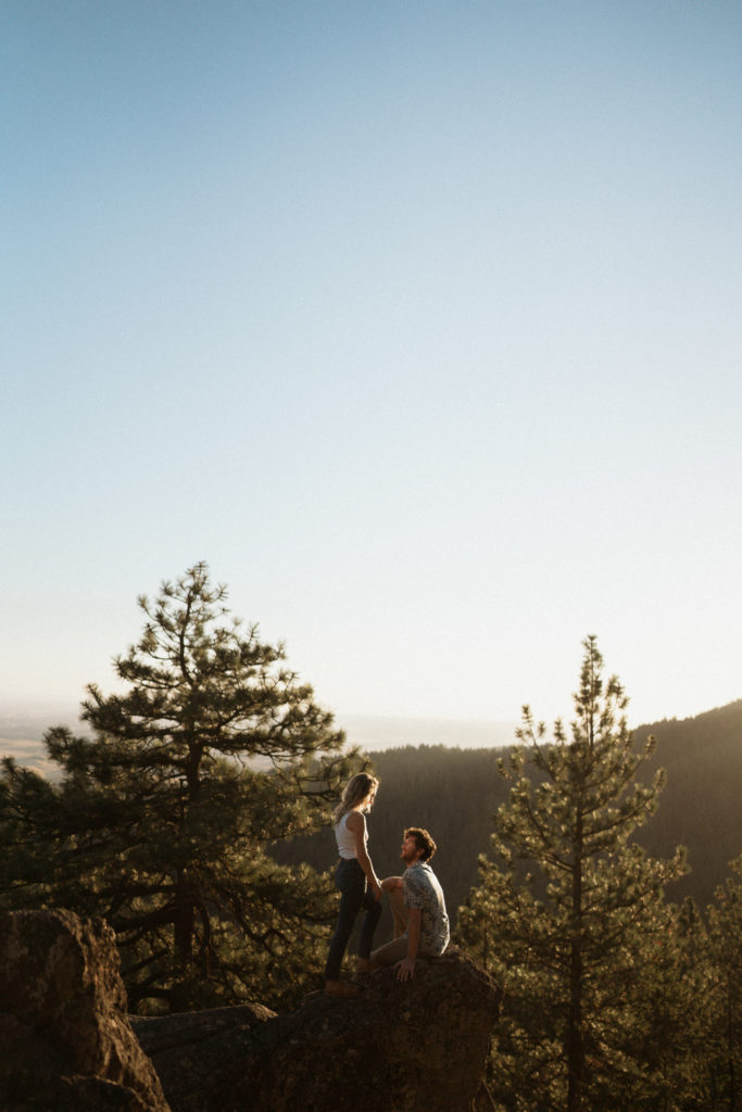 A couple shares and evening engagement session on Moscow Mountain in Idaho