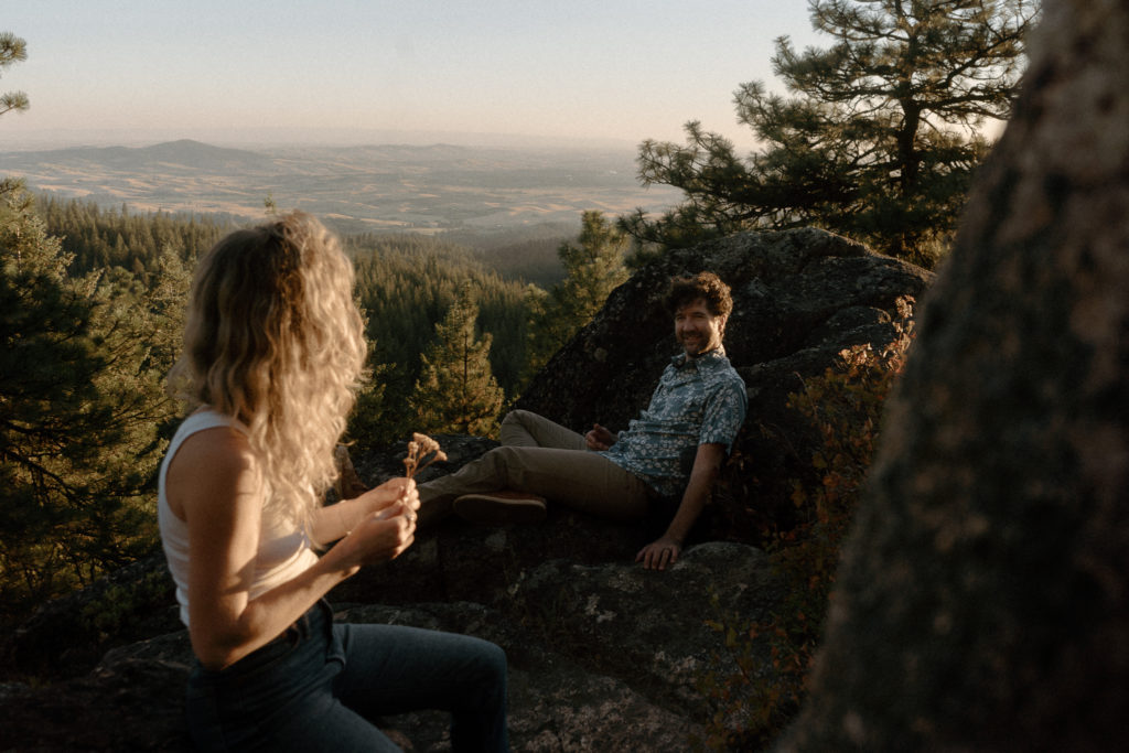 A couple shares and evening engagement session on Moscow Mountain in Idaho