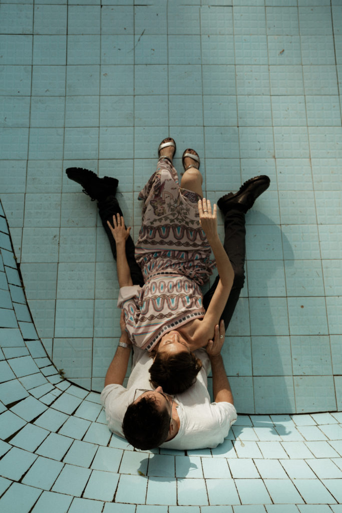 bride and groom embracing in abandoned pool at their bali elopement