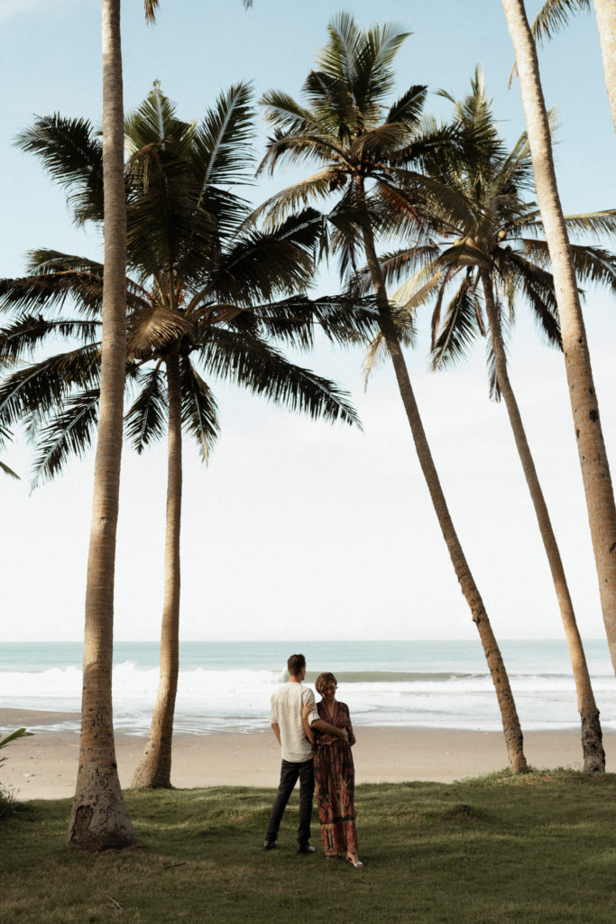 bride and groom looking at ocean at their bali elopement