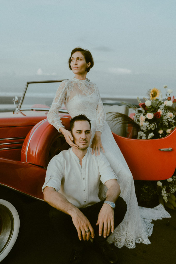 bride holding grooms face at their bali elopement