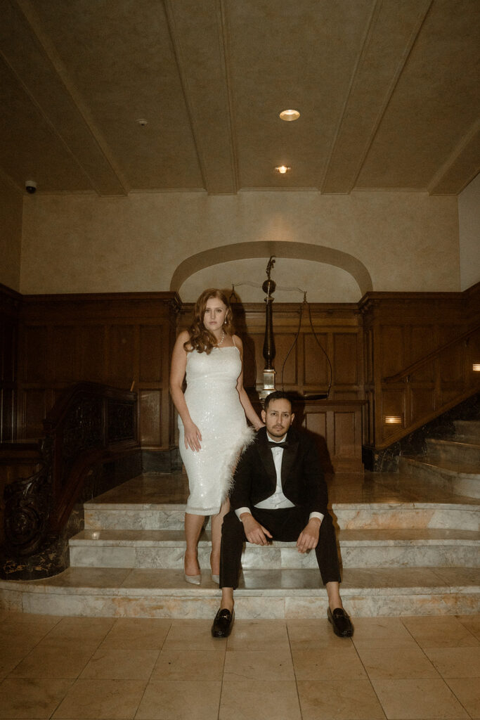 Couple posing for editorial engagement photos at The Benson Hotel in Portland.