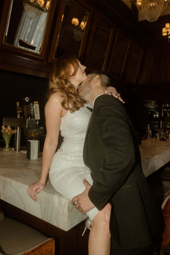 couple embracing during their engagement photo shoot at The Benson Hotel in Portland