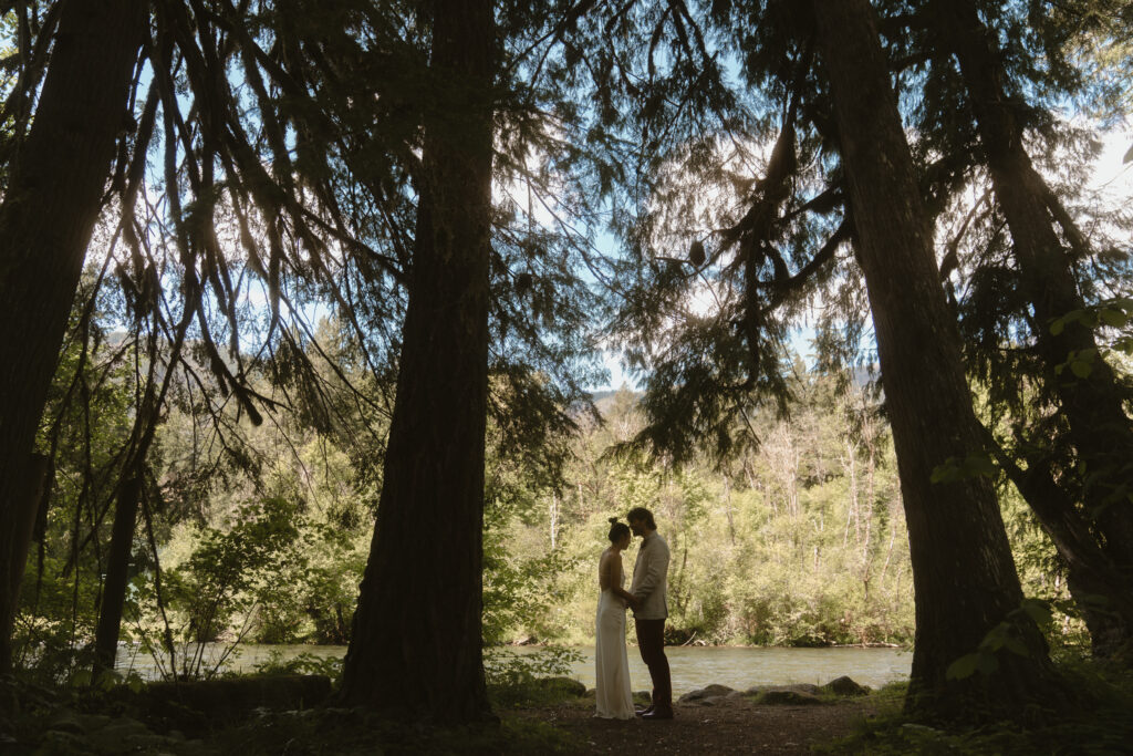 A moody Loloma Lodge wedding on the McKenzie River with forest vows and cozy cabin vibes
