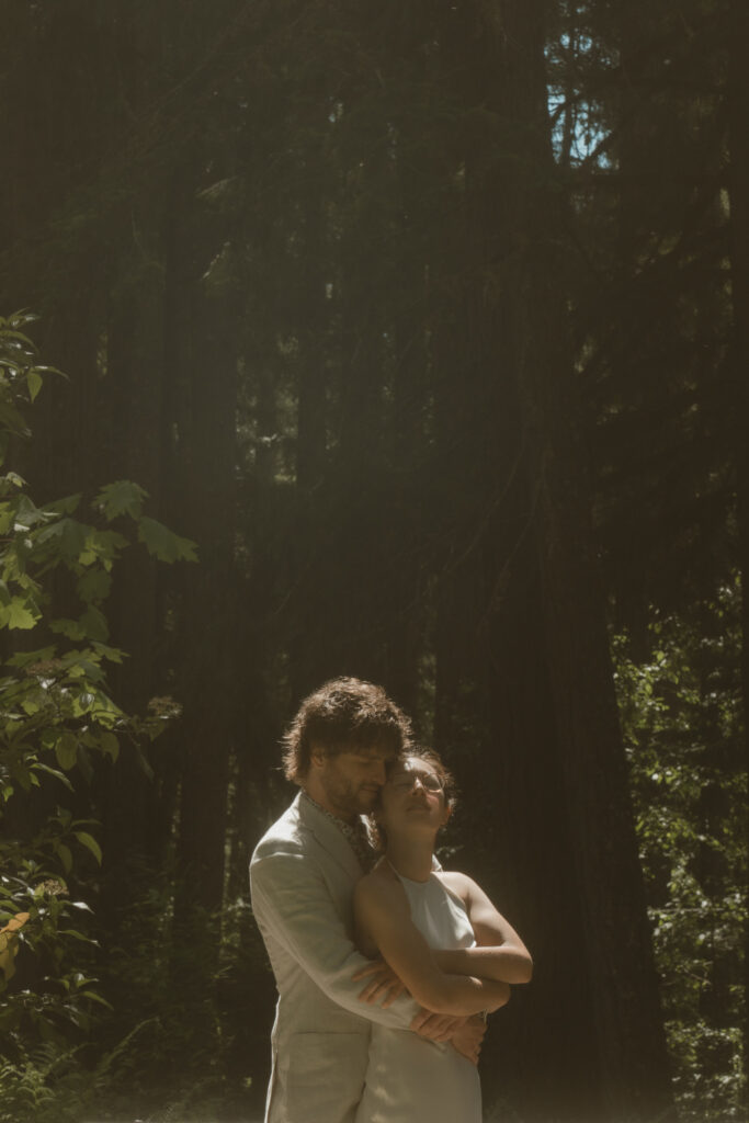 A moody Loloma Lodge wedding on the McKenzie River with forest vows and cozy cabin vibes