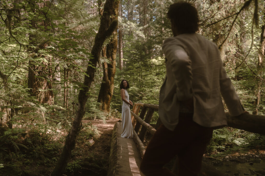 A moody Loloma Lodge wedding on the McKenzie River with forest vows and cozy cabin vibes
